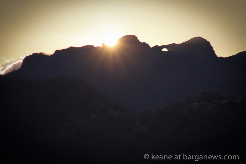 Double sunset obscured by clouds