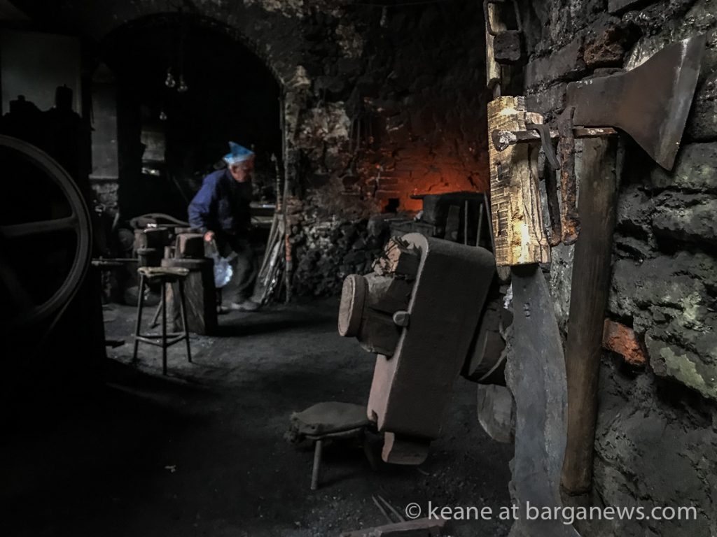Blacksmith using water powered machinery