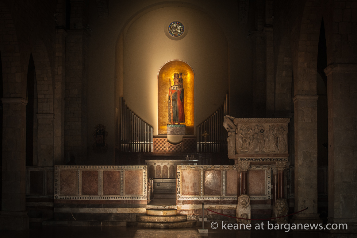 The winter sun strikes the huge wooden statue of St. Christopher