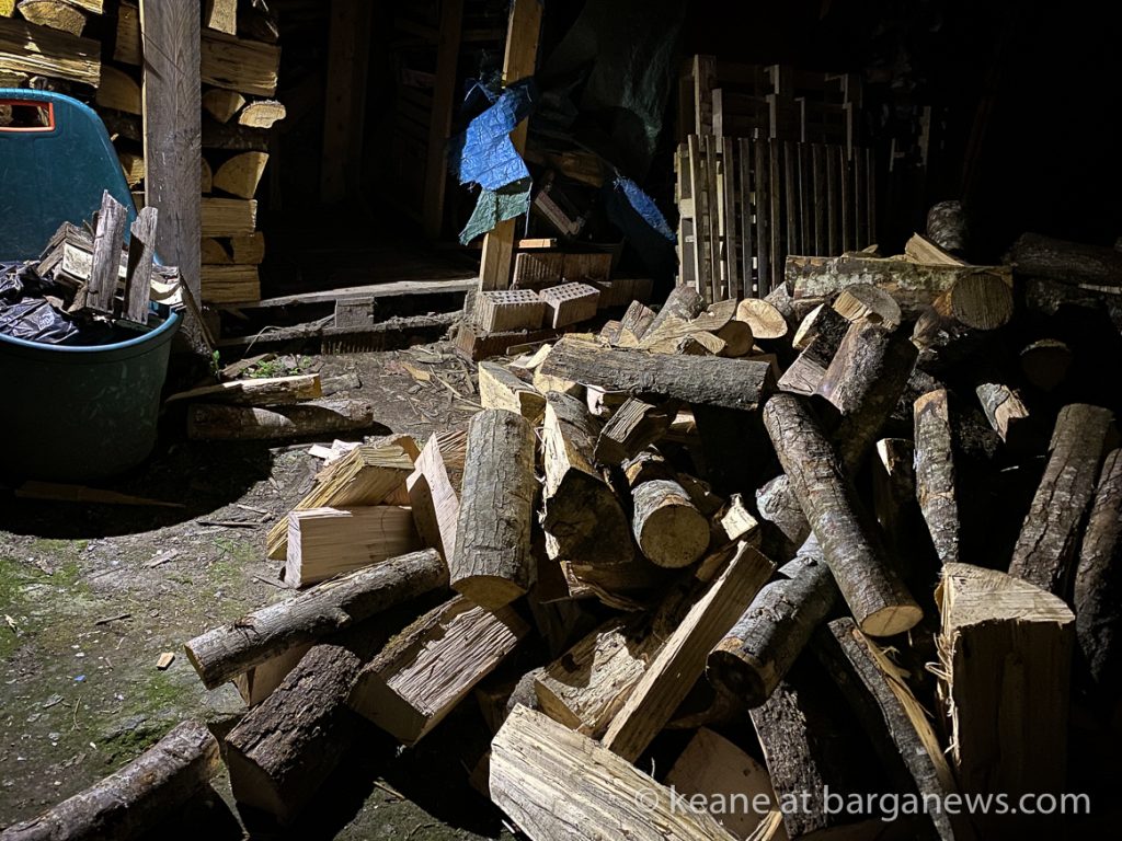 Tractor delivers wood at night in Barga Vecchia