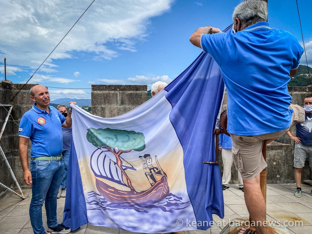 The flag of St. Christopher flies over Barga