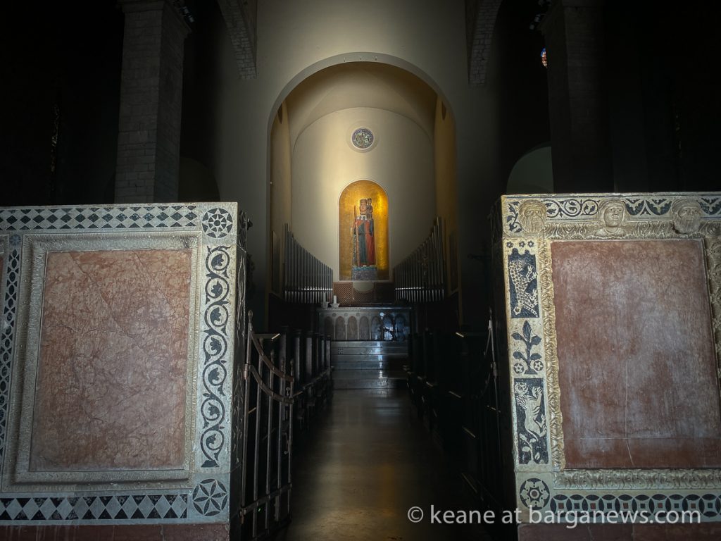 The sun strikes the wooden statue of St. Christopher